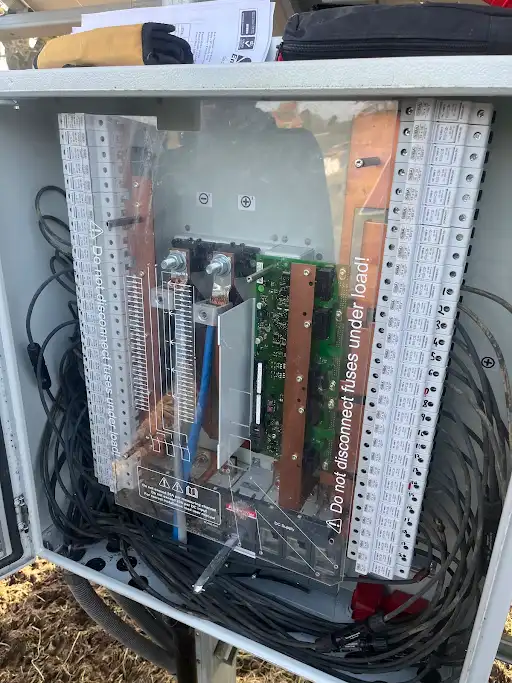 The inside of a computer case with wires and wires.